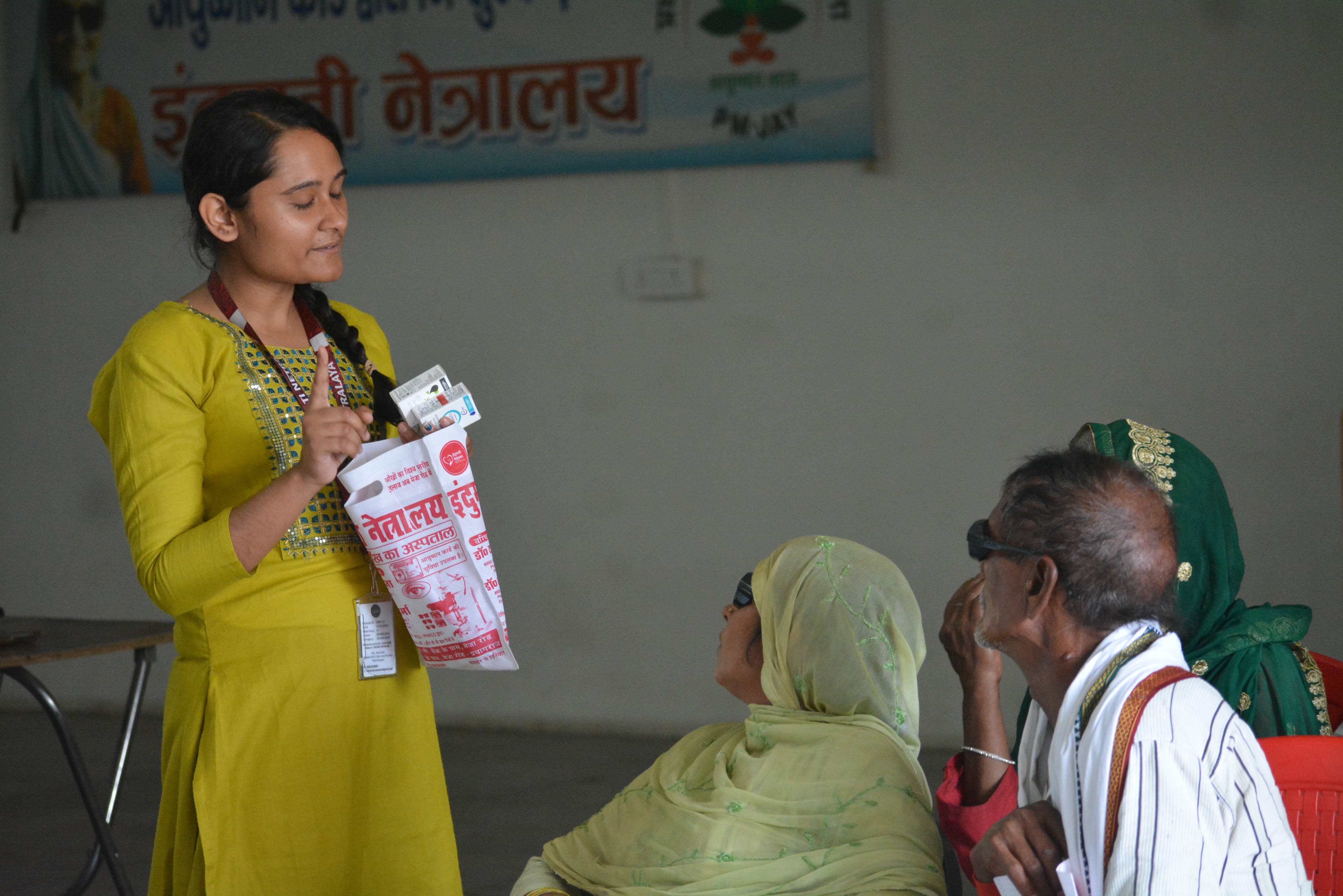 Indumati Netralaya staff conducting eye health education awareness session at village eye camp