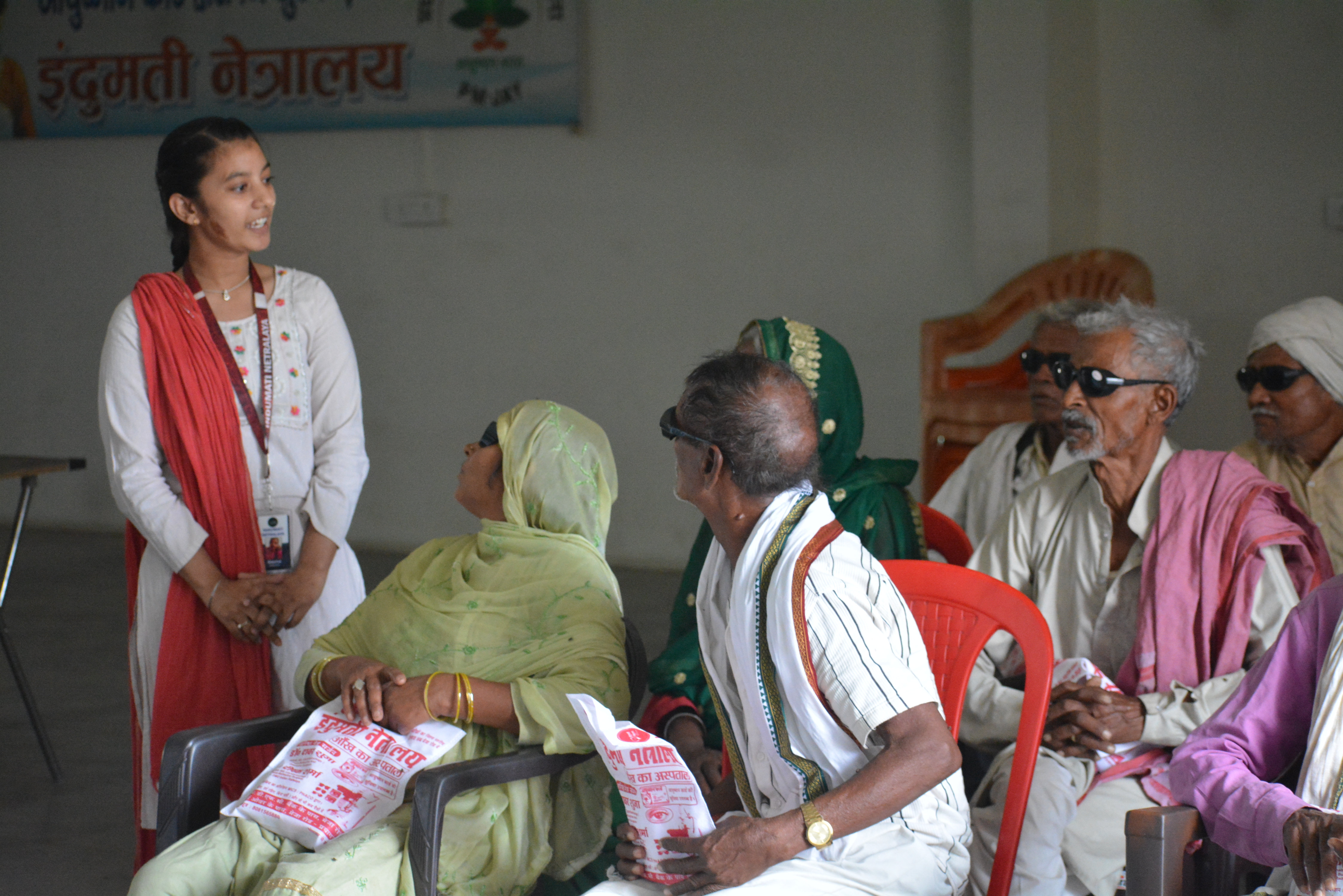 Indumati Netralaya village eye camp awareness session with rural community members in Prayagraj