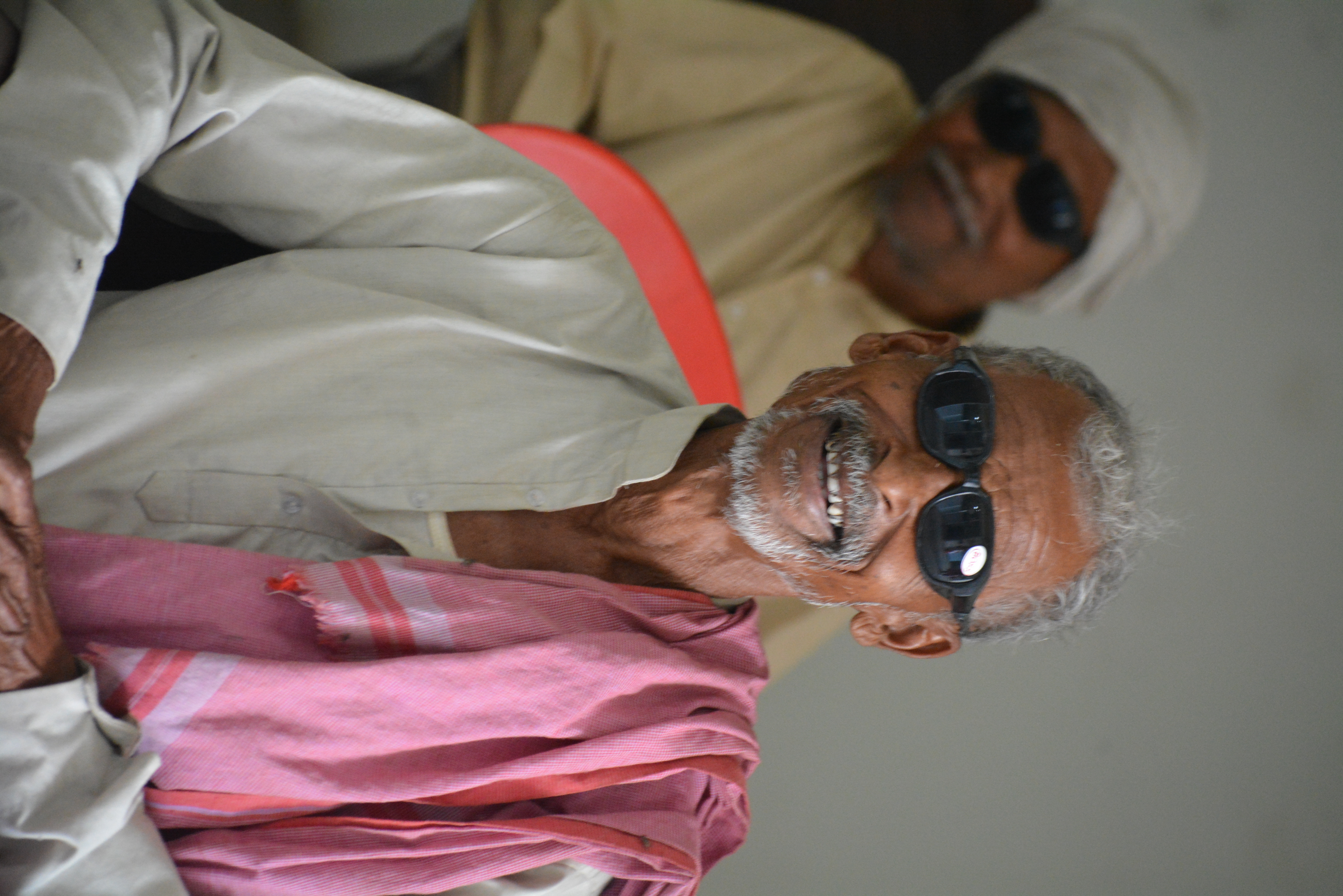 Elderly rural patient smiling after receiving free cataract surgery at Indumati Netralaya