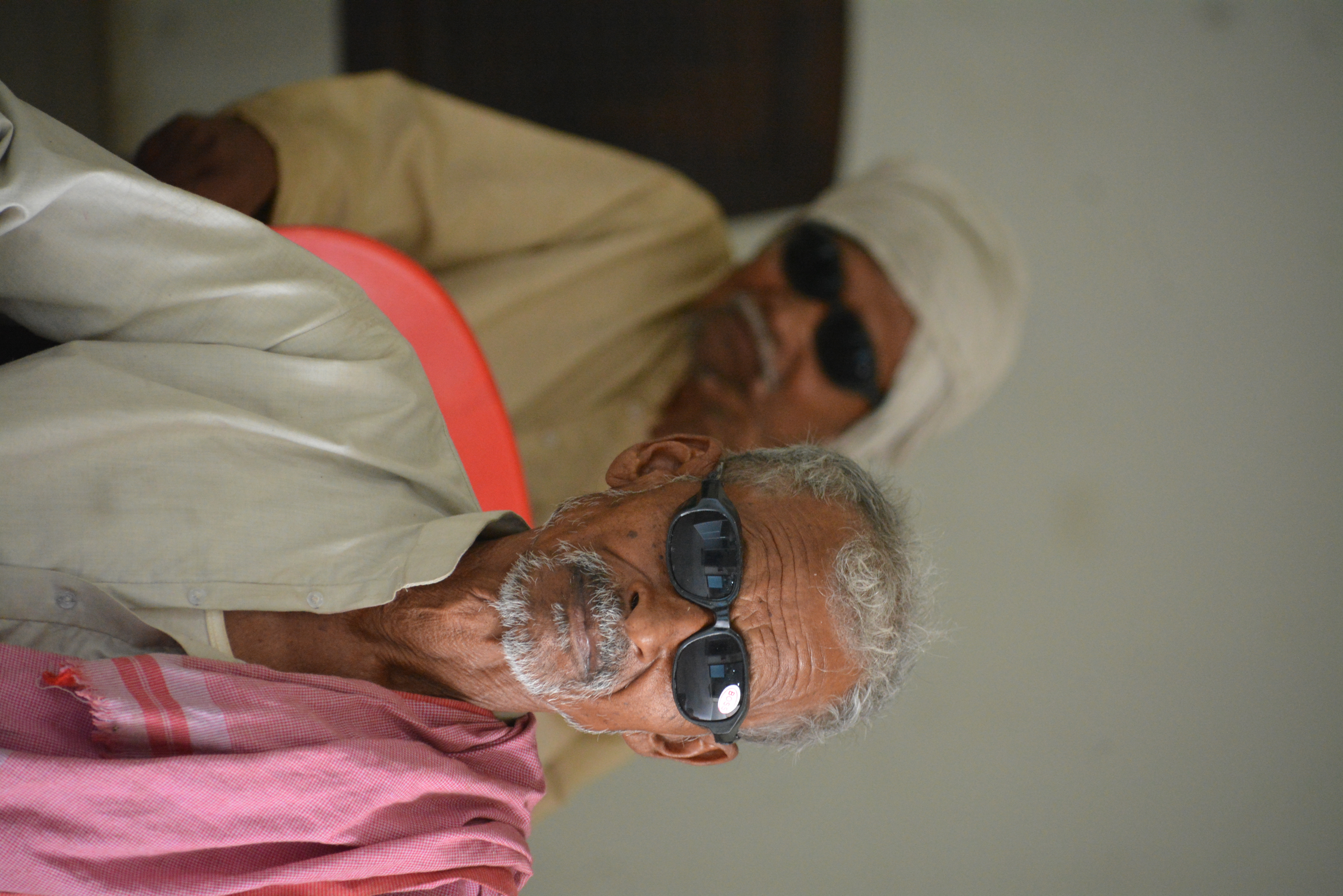 Elderly patient smiling after successful free cataract surgery at Indumati Netralaya, Kaushambi
