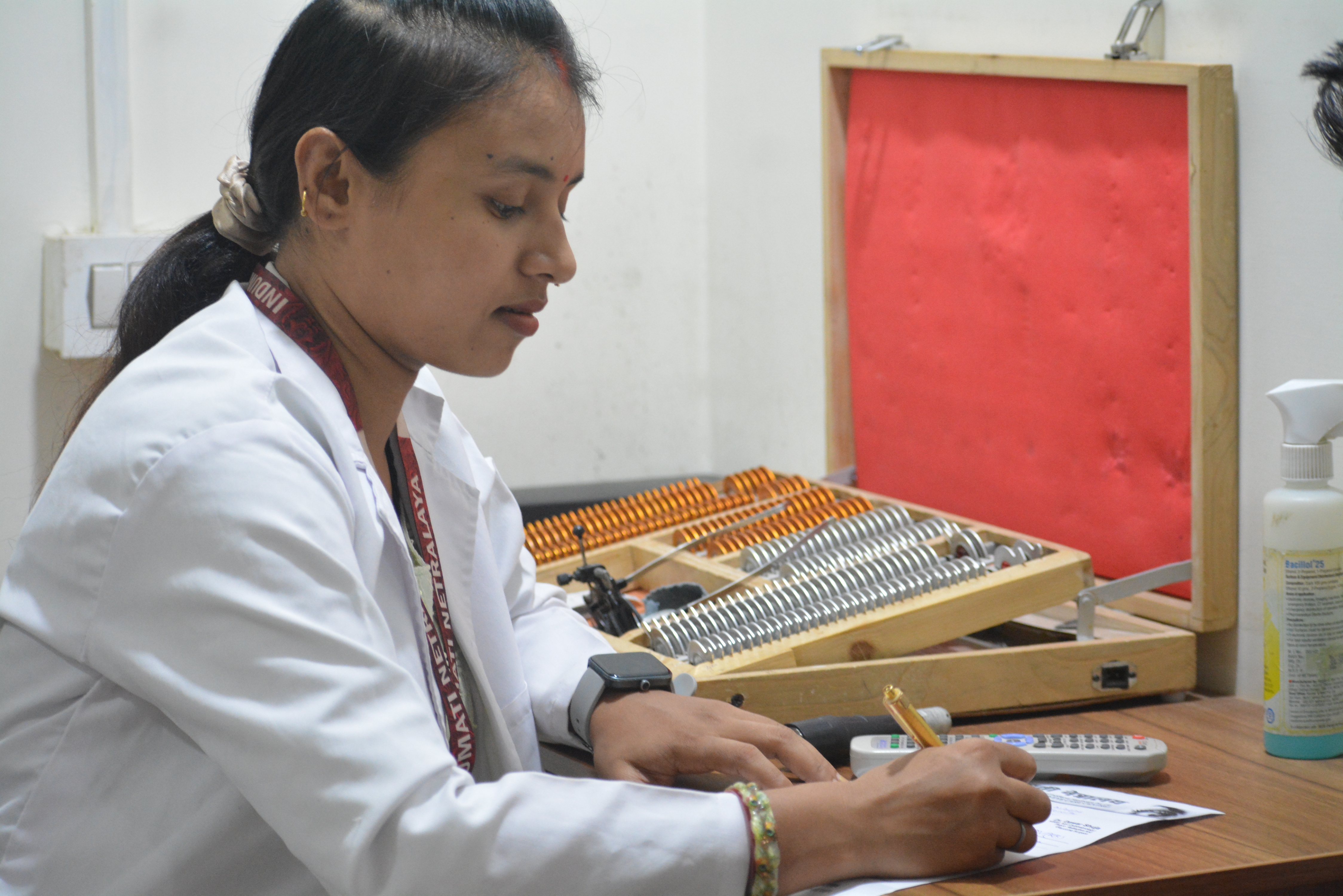 Optometrist conducting comprehensive vision testing and refraction at Indumati Netralaya, Prayagraj