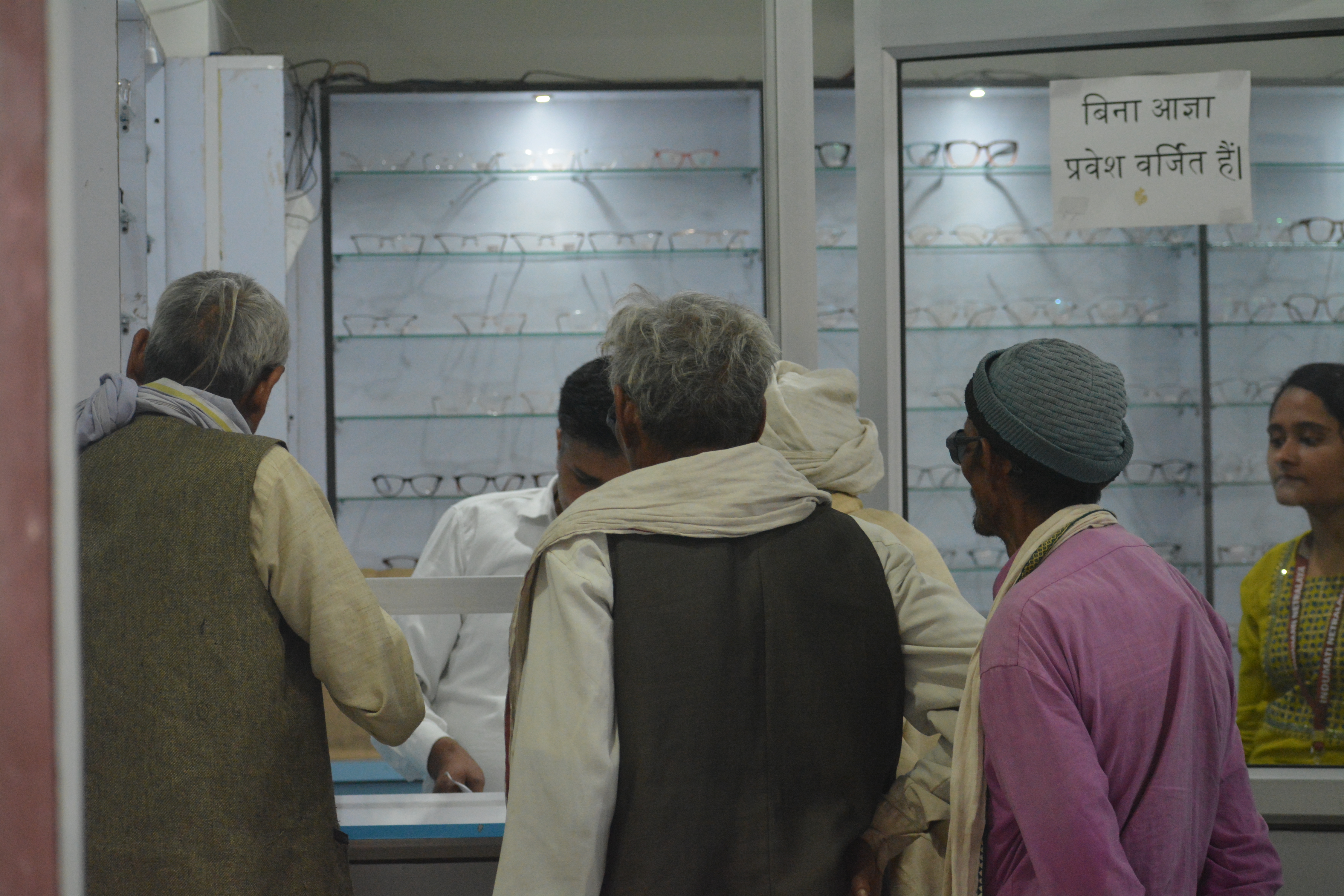 Patients selecting spectacle frames at Indumati Netralaya optical store, Prayagraj — affordable eyewear for rural patients
